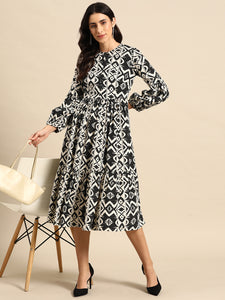 Midi Layered dress with balloon sleeve in Black and Cream Ikkat Print